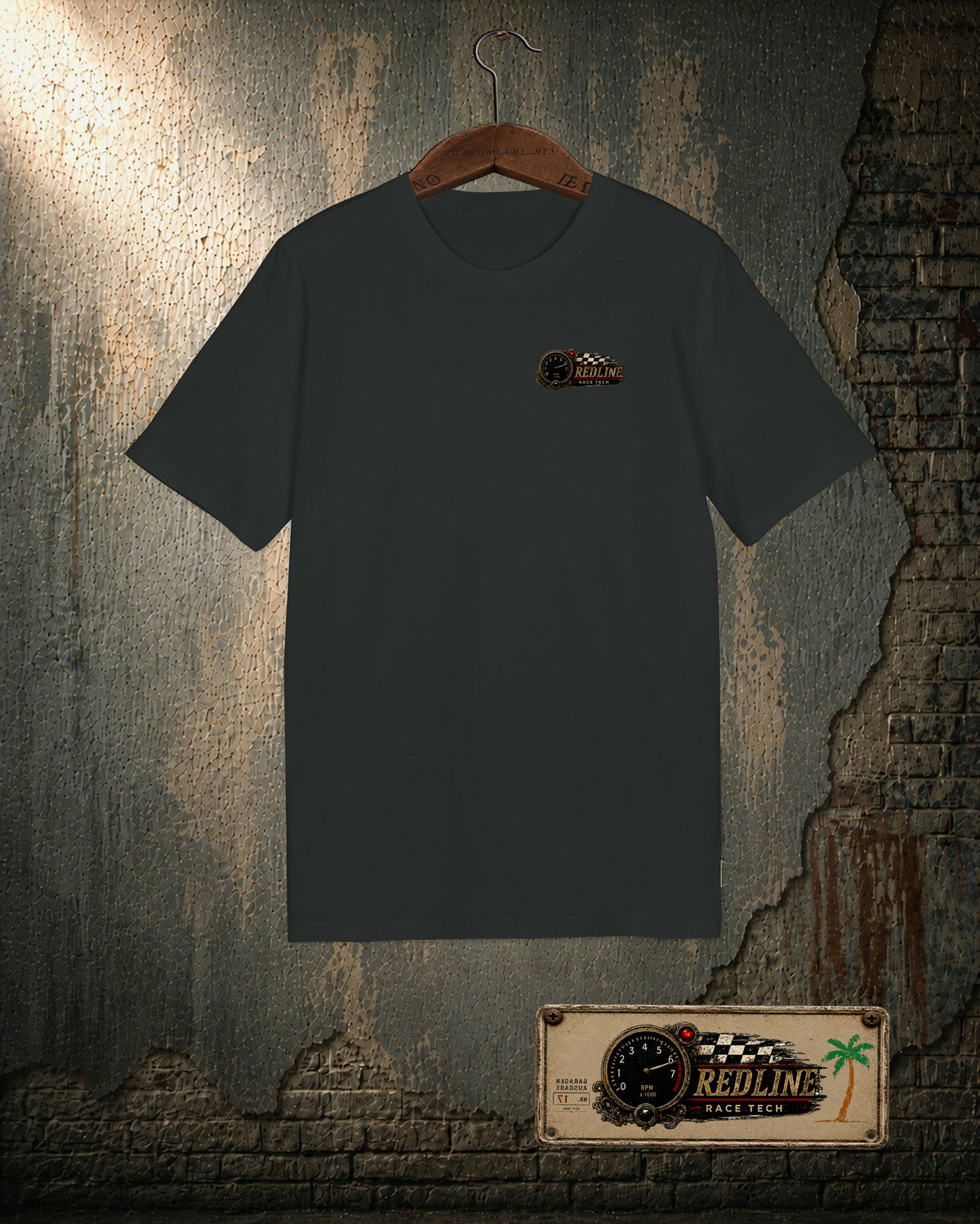 Redline Race Tech premium organic black T-shirt, front chest logo on the workshop wall mockup